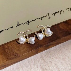 Elegant Gold and Pearl Bow Earrings
